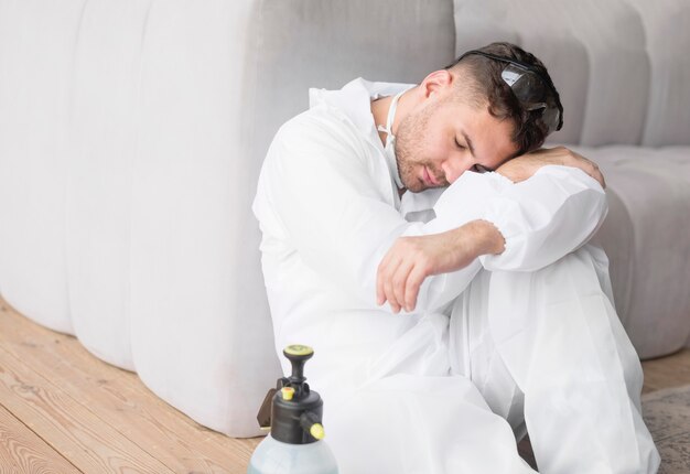 Free photo sleeping man with protective suit