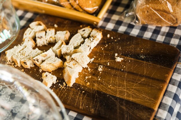 Slice of bread on cutting board at market stall