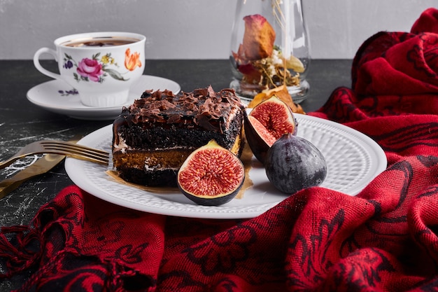 A slice of brownie cake with figs. 