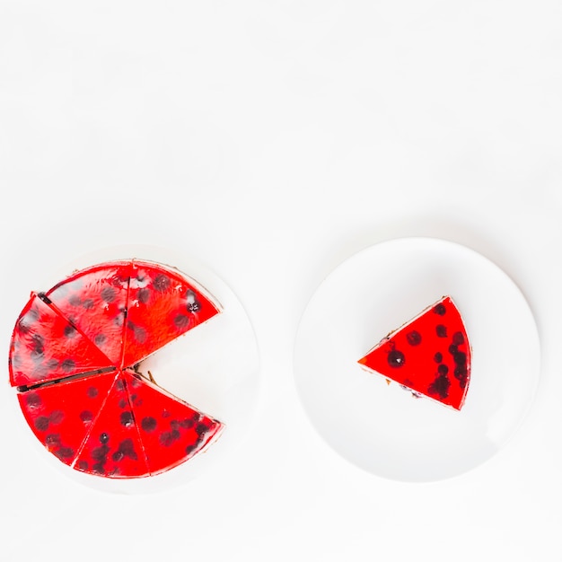 Slice of cake on plate isolated over white background