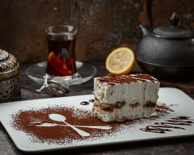 Slice of cake with cocoa powder