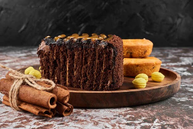 A slice of chocolate cake with cinnamons. 