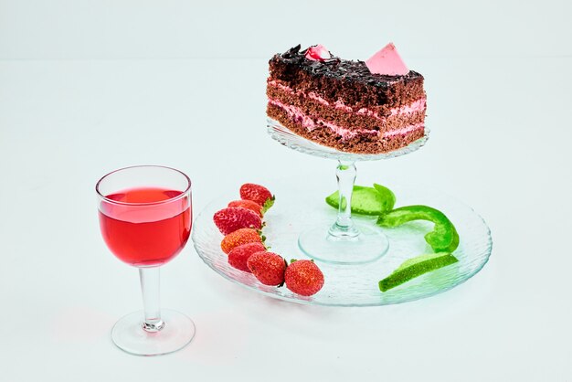 A slice of chocolate cake with fruit composition.