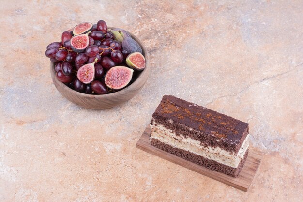 A slice of chocolate cake with purple figs