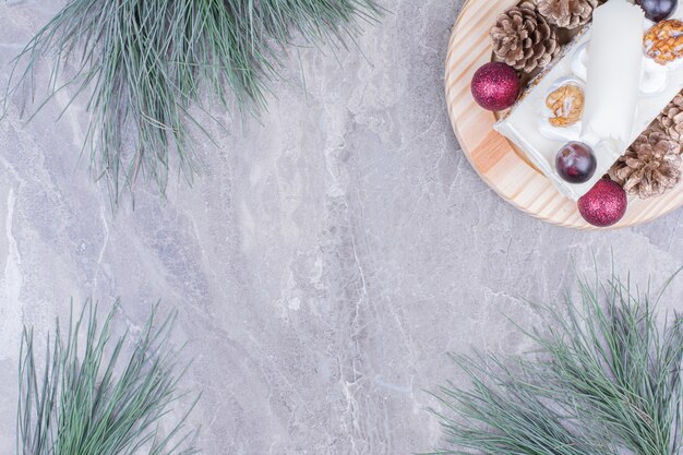 A slice of coconut cake on a wooden board in christmas concept