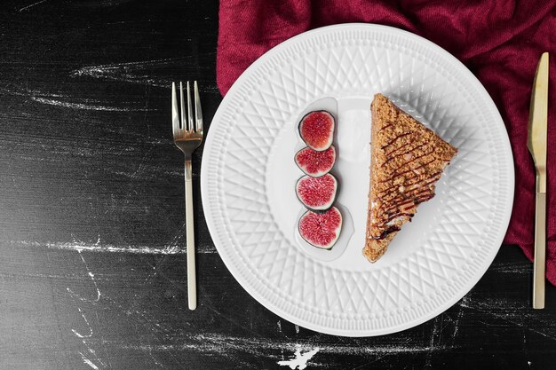 A slice of honey cake with figs.