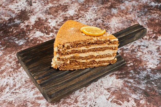 A slice of honey cake with lemon. 