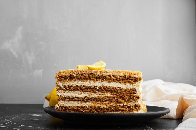 A slice of honey cake with lemon. 