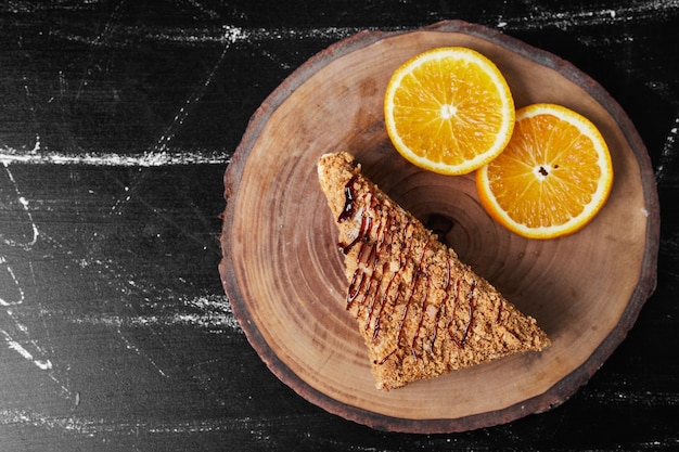 A slice of honey cake with orange slices