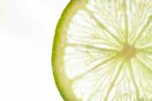 Free photo slice of lime with white background