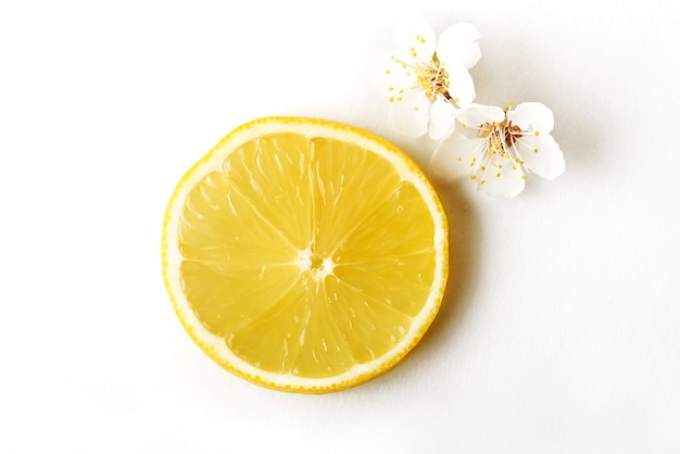 Slice ripe lemon citrus fruit on a white.