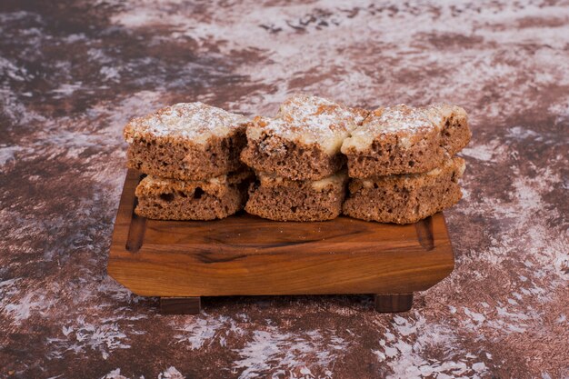 Sliced biscuits on a wooden platter