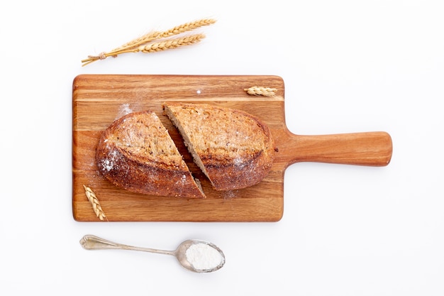 Free photo sliced bread on wooden board top view