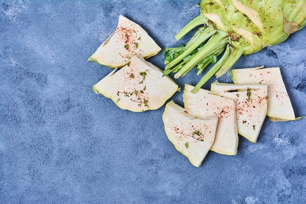 Sliced celery corn on blue