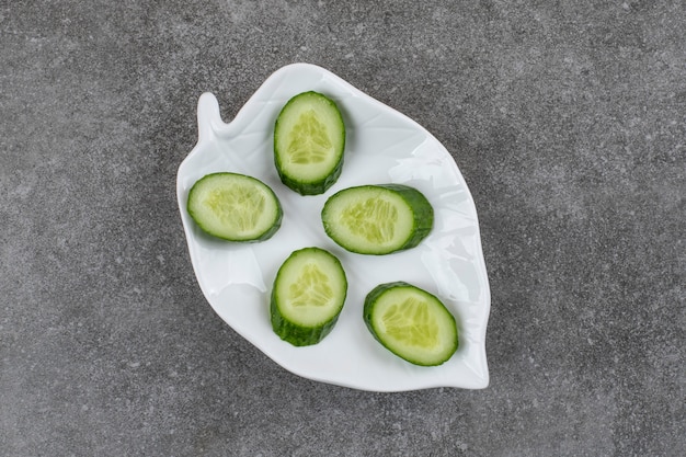 of sliced cucumbers on white plate.