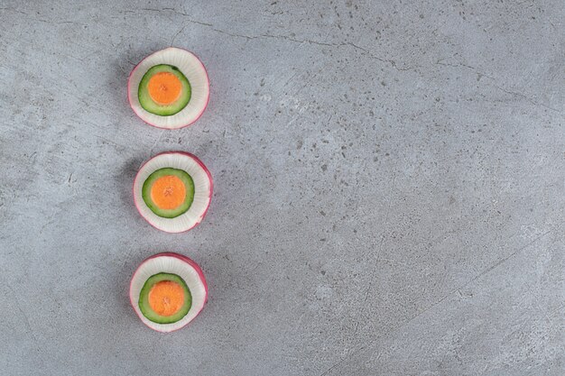 Sliced delicious vegetables on a gray background. High quality photo