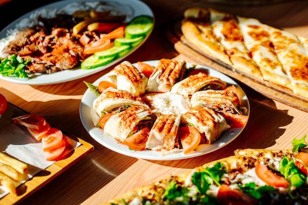 Sliced doner served with different meal