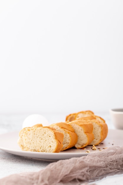 Sliced french baguette and cloth front view