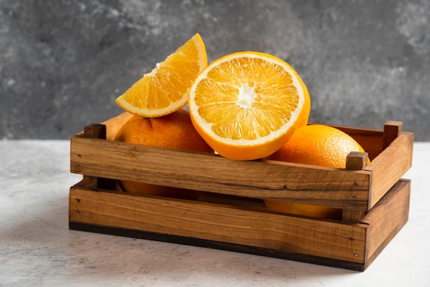 Sliced fresh oranges on marble.