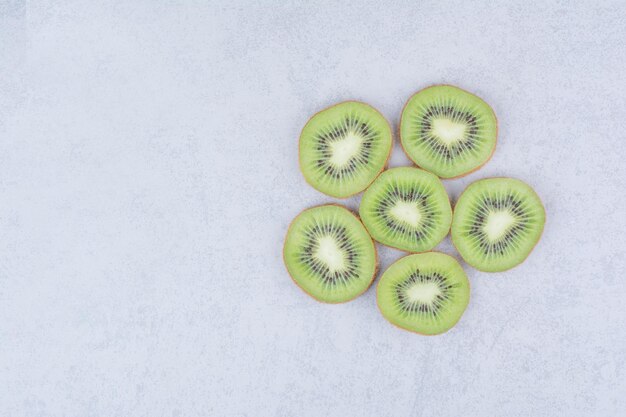 Sliced of fresh sweet kiwis on white background. High quality photo