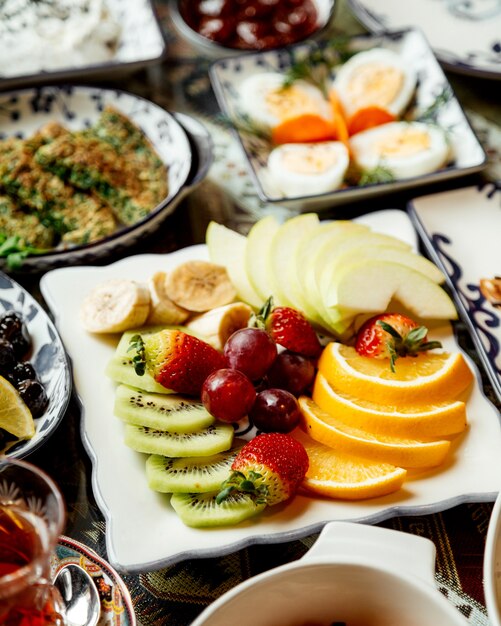 Sliced fruits on plate