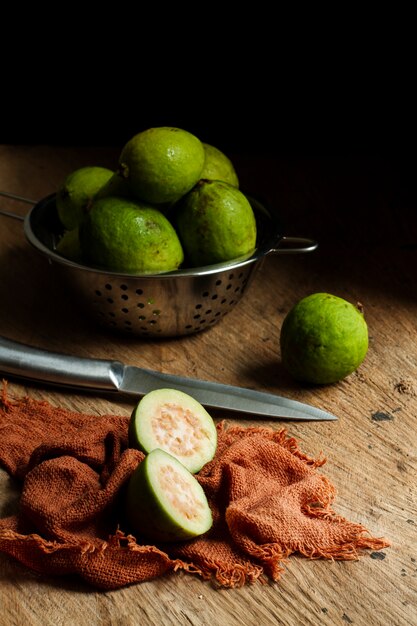 Sliced guava fruit on wooden table