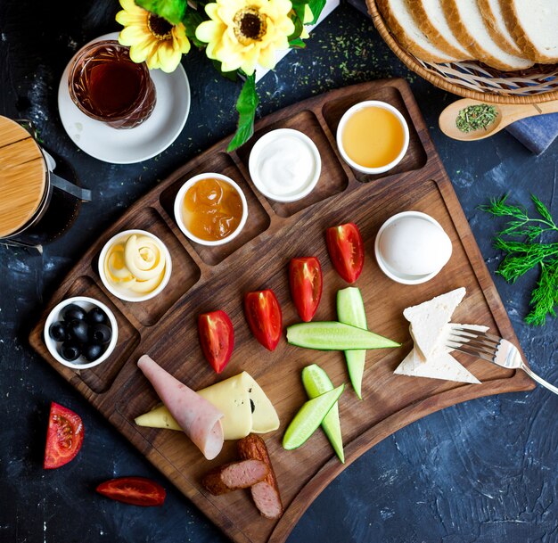 Sliced ham cheese and vegetables with jam