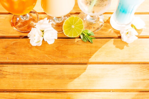 Sliced lemon flower mint and bright drinks 