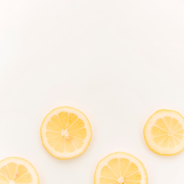 Sliced lemon on white background