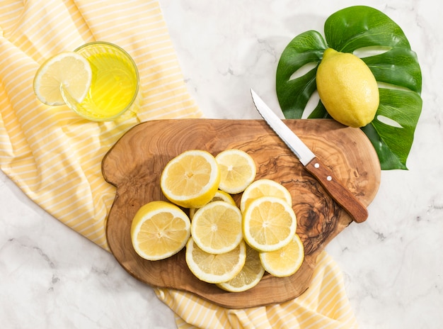 Sliced lemons on chopping board