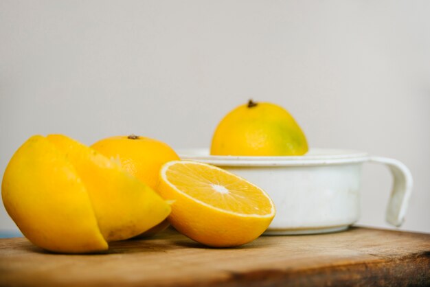 Sliced lime juice on wooden cutting board