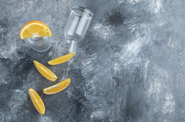 Sliced orange and empty on marble table. 