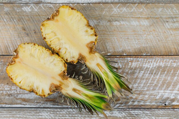 Sliced pineapple on a wooden surface