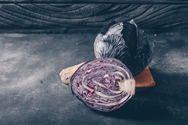 Sliced red cabbage on a dark textured background. high angle view.