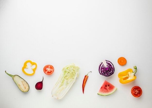 Sliced veggies on white background 