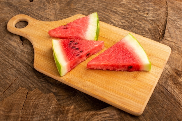 sliced watermelon fresh and sweet on brown wood