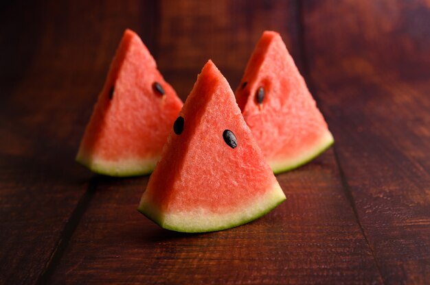 Sliced watermelon on a wooden table.