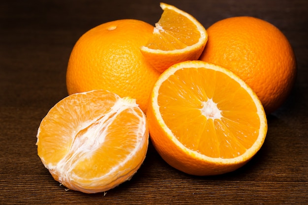 Sliced and whole oranges