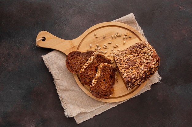 Slices of baked bread on wooden board