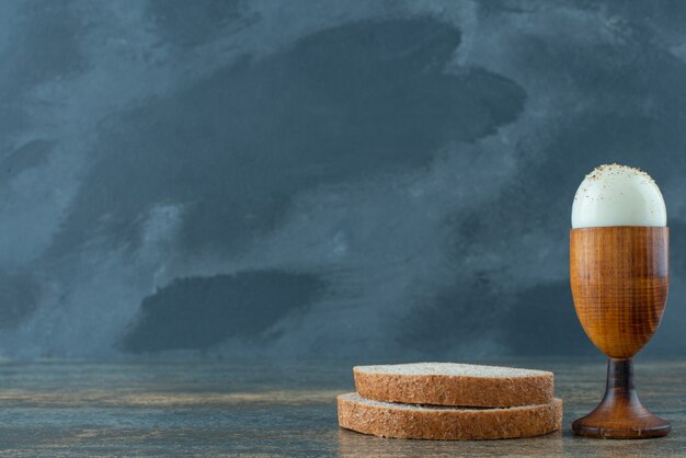 A slices of bread with boiled on marble background