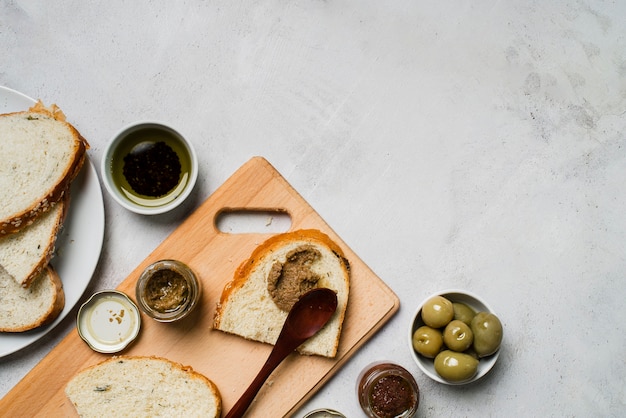 Slices of bread with olives and copy space