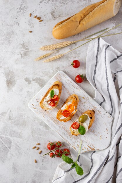 Slices of bruschetta on marble table