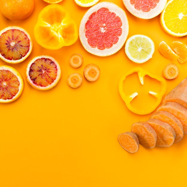 Slices of citrus fruit flat lay