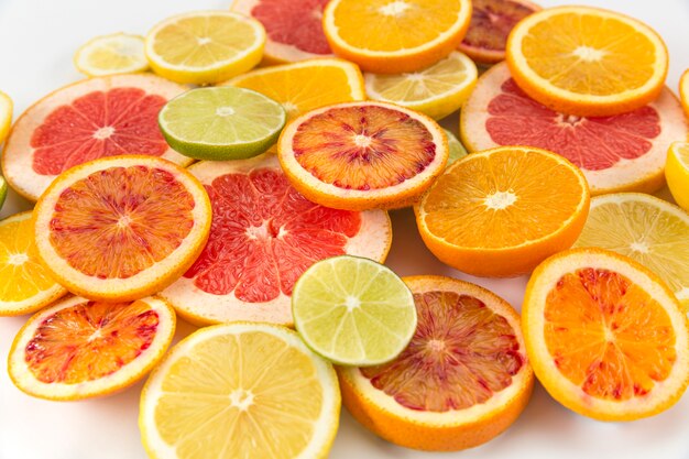 Slices of citrus fruit in a pile high view