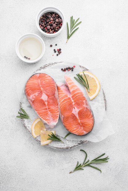 Slices of fresh salmon slices on white plate