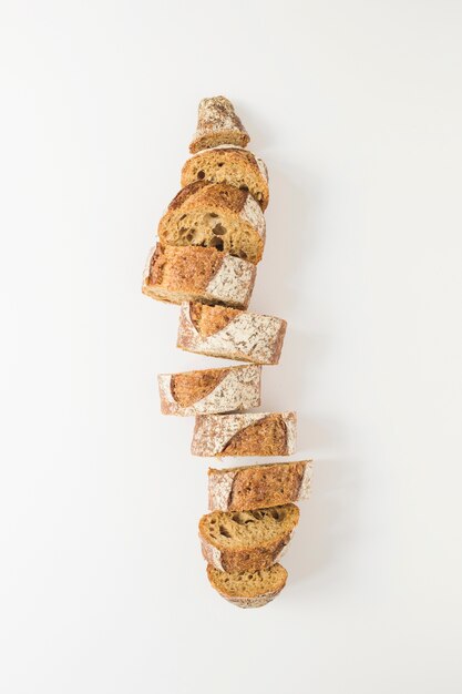 Slices of freshly baked baguette isolated on white backdrop