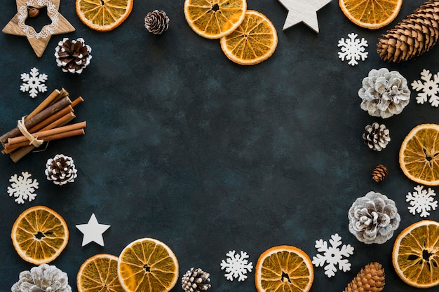 Slices of lemon and snowflakes winter frame