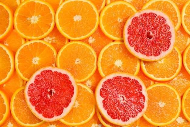 Дольки апельсинов и грейпфрутов в качестве фона.