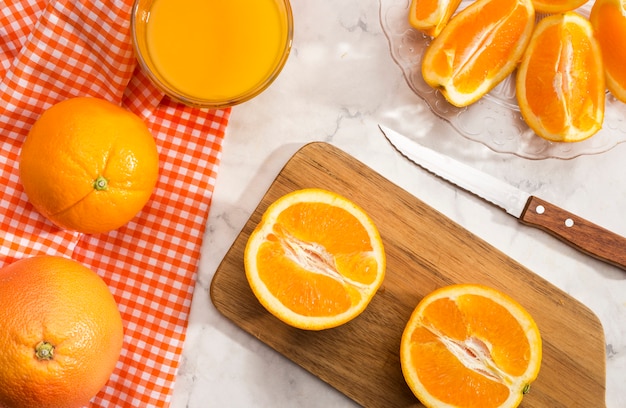 Slices of orange on wooden board