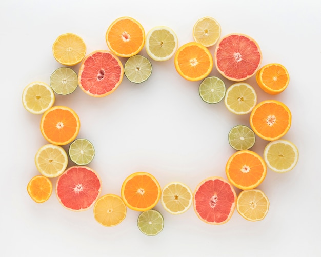 Slices of oranges and lemons top view